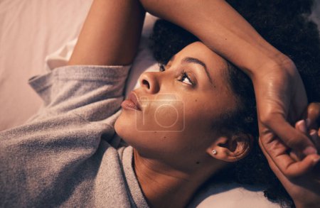 Photo for Tired, insomnia and night with woman in bedroom for stress, thinking and sad. Mental health, depression and fatigue with female person feeling lonely at home for anxiety, frustrated and fear problem. - Royalty Free Image