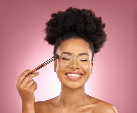 Photo for Makeup, smile and black woman with brush, natural beauty and skincare on a studio background. Female person, aesthetic and happy model with cosmetic tools, grooming and dermatology with self care. - Royalty Free Image
