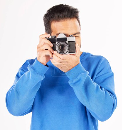 Photo for Retro camera, photography and man in studio for photoshoot, creative media and paparazzi. Male photographer, journalist and shooting with vintage equipment for production, lens and white background. - Royalty Free Image