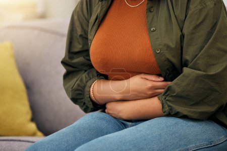 Photo for Sick woman, stomach pain and hands on abdomen for ibs, digestion and nausea of pms, virus or anxiety. Closeup female person, menstruation or belly problem of constipation, gut health or endometriosis. - Royalty Free Image