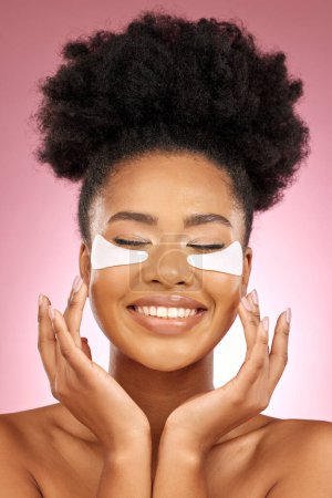 Photo for Woman, hyaluronic acid or eyes pad for beauty, cosmetic or skin product in studio by pink background. African girl, model or facial self care for glow, natural skincare or happy for aesthetic results. - Royalty Free Image
