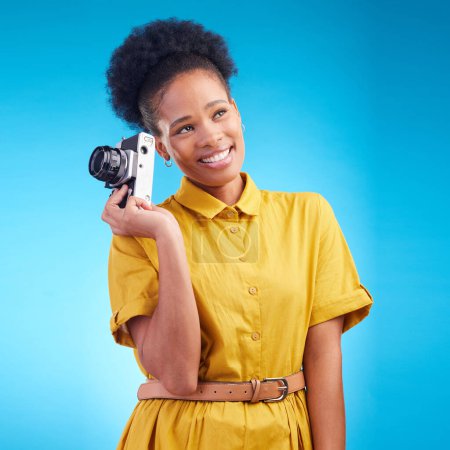Photo for Photography, smile and black woman with camera isolated on blue background, creative artist job and talent. Art, face of happy photographer with hobby or career in studio on travel holiday photoshoot. - Royalty Free Image