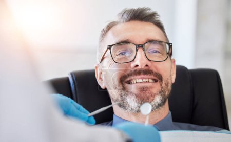 Photo for Senior man, smile and teeth, dentist and metal tools with health consultation, dental and oral care at clinic. Orthodontist, healthcare and medical check, gingivitis and cleaning mouth with wellness. - Royalty Free Image