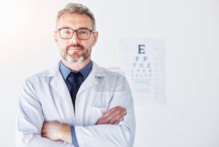Photo for Senior man, arms crossed with optometrist in portrait, vision and glasses, eye care clinic and healthcare. Male person, ophthalmology and health for eyes, eyesight assessment and prescription lens. - Royalty Free Image