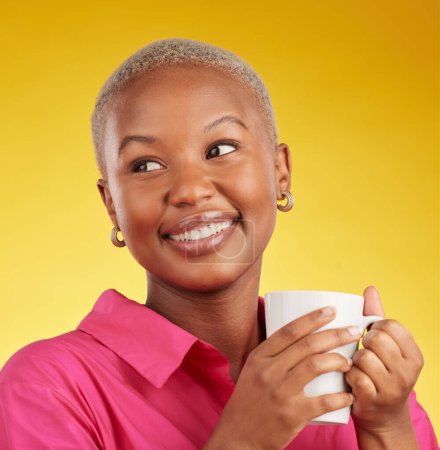 Photo for Woman, thinking and smile with coffee in studio for motivation, inspiration and a break. Face of a happy black female model person on a yellow background with a tea cup for ideas, choice and relax. - Royalty Free Image