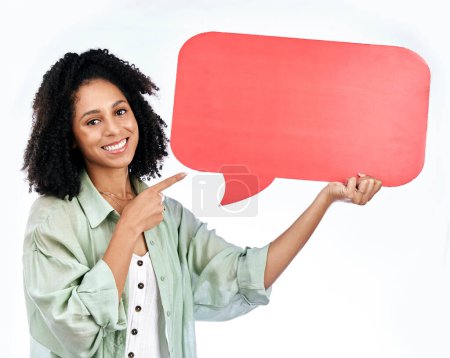 Photo for Woman, studio portrait and point at speech bubble with smile for promo, mockup or space by white background. Isolated African girl, happy student and sign for poster, paper billboard or social media. - Royalty Free Image