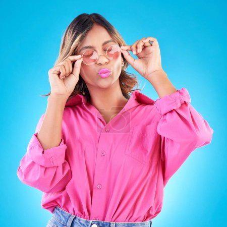 Photo for Fashion sunglasses, makeup and woman in studio isolated on a blue background. Cosmetics, glasses and Indian model with lipstick, style and casual summer clothes for aesthetic, gen z and eyes closed. - Royalty Free Image