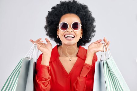 Photo for Happy black woman, face and shopping bags for fashion or style against a white studio background. Portrait of African female person, customer or shopper smile for discount, sale or deal in happiness. - Royalty Free Image