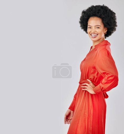 Foto de Retrato, moda y espacio con una mujer negra afro en el estudio sobre un fondo blanco para el estilo de moda. Burla, sonrisa y ropas rojas con una modelo joven y feliz posando en un atuendo de ropa. - Imagen libre de derechos