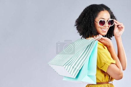 Photo for Shopping, bag and woman happy for retail sale, promotion or excited for discount on studio, mockup or grey background. Customer, portrait or girl to shop for fashion or sales on luxury clothing. - Royalty Free Image