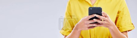Photo for Phone, banner or hands of person in studio scrolling on social media, mobile app or internet. Online, research or closeup of woman typing on digital technology on white background with mock up space. - Royalty Free Image