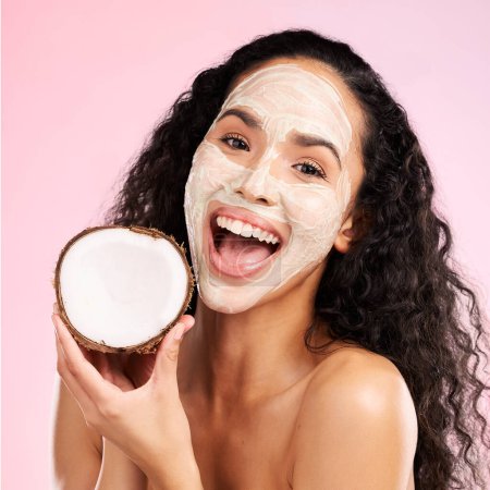 Photo for Mask, facial and portrait of woman with coconut for wellness, beauty and cosmetics on pink background. Dermatology, skincare and female person with fruit for organic detox, natural face and cleaning. - Royalty Free Image
