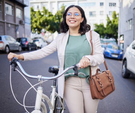 Photo for Business woman, bicycle and thinking in street, city and sustainable travel with smile, ideas and accountability. Young entrepreneur, employee and bike for ecology, climate change or transport in cbd. - Royalty Free Image