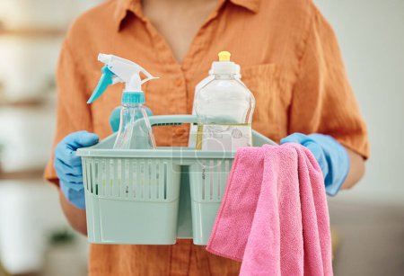 Photo for Hands of person with detergent basket for cleaning, housekeeping and disinfection of dirt, bacteria and dust. Closeup of cleaner, maid and container of chemical bottles, products and liquid tools. - Royalty Free Image