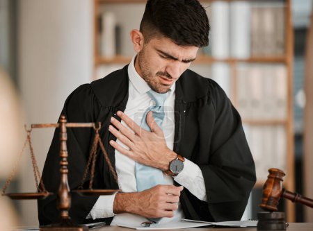 Photo for Lawyer man, chest pain and office with stress, tired or burnout for cardiovascular problem at desk. Judge, attorney or advocate with heart attack, emergency or injury for lungs, breathing or accident. - Royalty Free Image