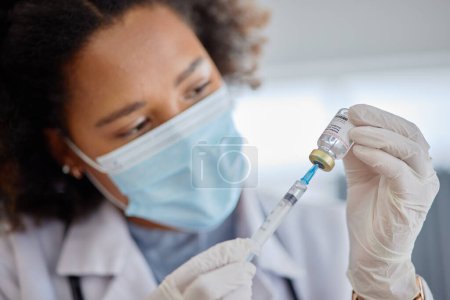 Photo for Smallpox, vaccine and vial with doctor, needle and healthcare safety in hospital. Woman, nurse with face mask and injection for vaccination, virus and bottle for immunity, medical development or help. - Royalty Free Image