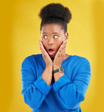 Photo for African girl, surprise and face with news or announcement in isolated or yellow studio background for notification. Wow, gossip and woman with open mouth or omg expression about drama or secret - Royalty Free Image