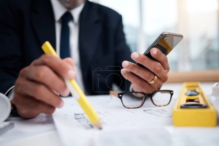 Photo for Phone, hands and pencil of architect man in an office with a blueprint, drawing or floor plan project. Closeup of male engineer with building design, internet connection and sketch for construction. - Royalty Free Image
