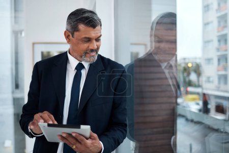 Photo for Business, window and senior man with a tablet, thinking and connection with network, inspiration or digital planning. Consultant, employee or entrepreneur with technology, glass or idea for a project. - Royalty Free Image