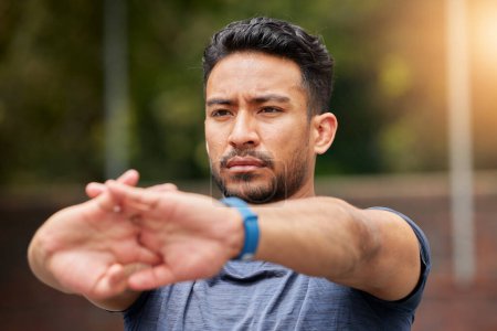 Photo for Serious, fitness or man stretching arms in exercise, training or healthy sports outdoor. Face of strong asian athlete focus to warm up in workout, performance or thinking of mobility, energy or power. - Royalty Free Image
