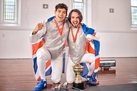 Photo for Britain flag, fencing and portrait of men with trophy for winning competition, challenge and match. Sports, sword fighting and excited male athletes celebrate with prize for games and tournament. - Royalty Free Image