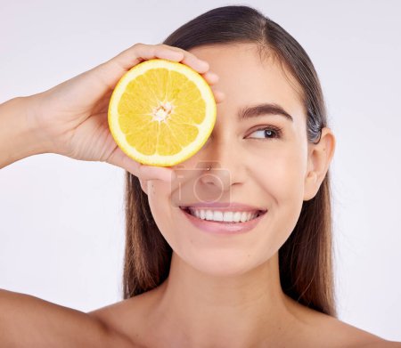 Photo for Beauty, studio face and happy woman with lemon for skincare glow, vitamin c detox and natural facial exfoliation. Fruit, organic cosmetics and person with citrus product benefits on white background. - Royalty Free Image