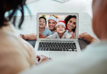 Photo for Christmas, family and video call on laptop in portrait, happy and communication. Xmas, computer and kids with parents in online chat for celebration of holiday in virtual webinar with face of couple. - Royalty Free Image