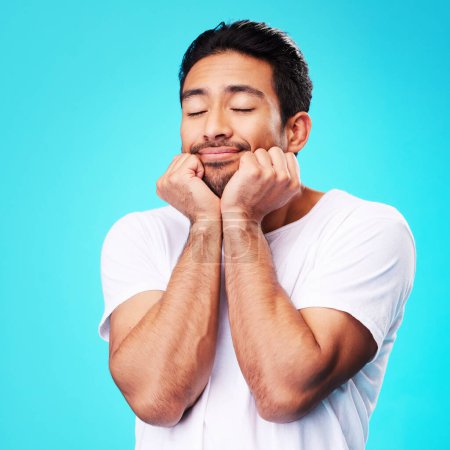 Photo for Calm, relax and man face in studio with sleeping with memory, smile and thinking to remember. Isolated, blue background and happy male model with eyes closed for rest and nap feeling thoughtful. - Royalty Free Image