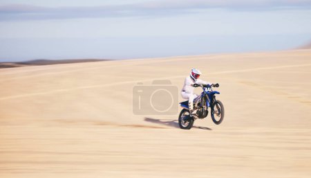 Photo for Race, motorcycle and person in desert, action and extreme sport with speed, riding outdoor and mockup space. Adventure, fitness and training, motorbike exercise and freedom, challenge and performance. - Royalty Free Image