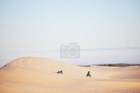 Photo for Desert, sports people and motorbike race, rally or off road marathon travel, journey and driving on competition adventure. Motorcycle speed, extreme challenge or fast racer training on sand dunes. - Royalty Free Image