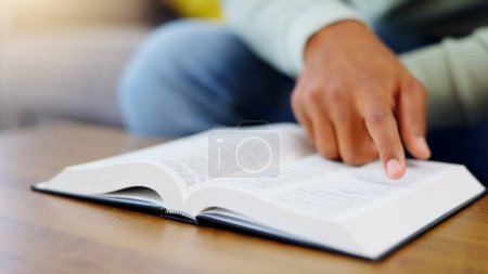 Photo for Prayer, reading and bible with man in living room for worship, spiritual and Christian faith. Hope, God and belief with person praying with holy book at home for religion, thinking and gratitude. - Royalty Free Image