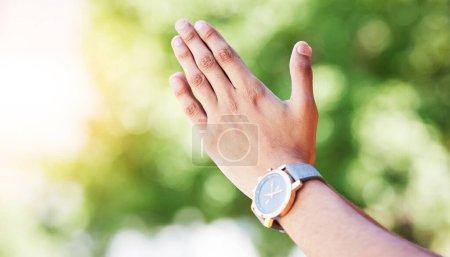 Photo for Hand, time and watch with a person outdoor in nature on a green background for freedom, meditation or zen. Yoga, fitness and wellness with an adult alone in the park, garden or backyard closeup. - Royalty Free Image