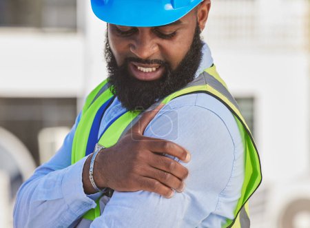 Photo for Black man, engineer or hand on shoulder pain, injury accident or muscle tension on rooftop. Hurt, stress or injured male contractor with sore arm, ache and joint inflammation at construction site. - Royalty Free Image