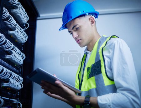 Photo for Man, engineering and server room, tablet and data center management, power upgrade or cybersecurity check. Young, electrician person on digital tech for programming, electricity or cables maintenance. - Royalty Free Image