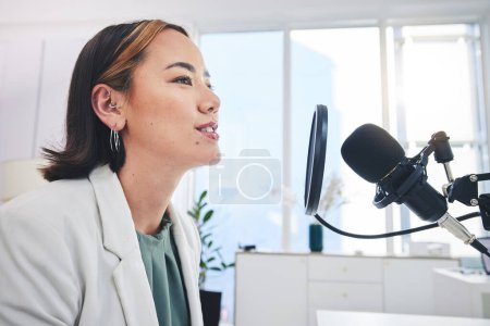 Photo for Woman, radio presenter and speech on microphone, thinking and ideas for financial advice on air. Podcast host, recording and business talk show with sound, tech and info on live streaming in studio. - Royalty Free Image