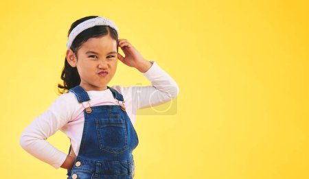 Photo for Confused, doubt and portrait of kid thinking in studio isolated on a yellow background mockup space. Question, idea face and girl child trying to remember memory, solution or choice, decision or why. - Royalty Free Image