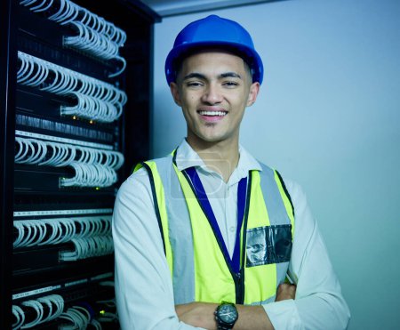 Photo for Engineering, portrait and man with smile in server room for network maintenance, software upgrade and programming cables. IT technician, electrician or arms crossed in data center for database backup. - Royalty Free Image