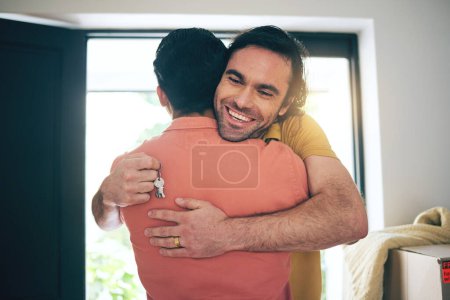 Photo for House, keys and gay couple hug in real estate, success or new home celebration together. Property, invest or lgbt men embrace for love, happy or smile for rental, apartment or celebrate mortgage loan. - Royalty Free Image