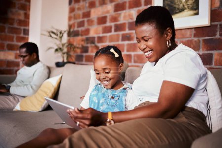 Photo for Happy, learning and a mother with a tablet and a child for a cartoon, movies or games on the sofa. Smile, reading and an African family, mom or girl kid with technology for social media in a house. - Royalty Free Image