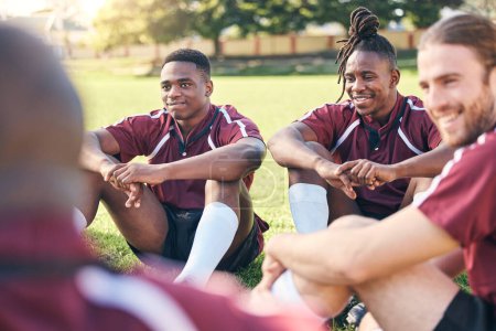 Photo for Sports, rugby and men on grass for rest at training, practice and exercise workout for match. Fitness, teamwork and male people relax for planning strategy for competition, challenge or game on field. - Royalty Free Image
