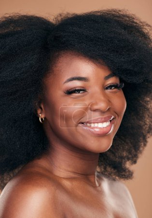 Photo for Portrait, hair care and black woman with beauty, shine and wellness on brown studio background. Growth, person or African model with texture, afro or cosmetics with aesthetic, face or smile with glow. - Royalty Free Image