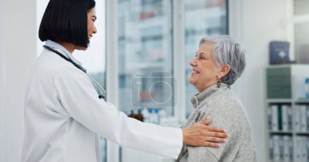 Photo for Senior support, talking and woman with a doctor for healthcare advice, consultation and results. Smile, hospital and an elderly patient with a clinic worker and care for a surgery discussion. - Royalty Free Image