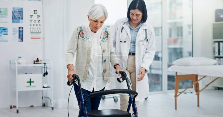 Photo for Old woman, doctor and physiotherapy with walking frame for support, help and healthcare. Senior, medical professional and person with a disability in hospital, rehabilitation and physical therapy - Royalty Free Image