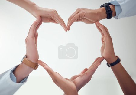 Photo for Heart, teamwork or hands of doctors with support in collaboration for healthcare wellness together. Closeup, love shape or medical nurses with group solidarity, integrity or mission with mockup space. - Royalty Free Image