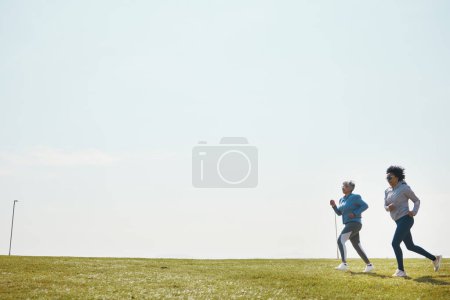 Photo for Women are running, fitness and cardio outdoor with training for marathon with mockup space. Female runner team in park, exercise and triathlon race with sports and athlete, health and wellness. - Royalty Free Image