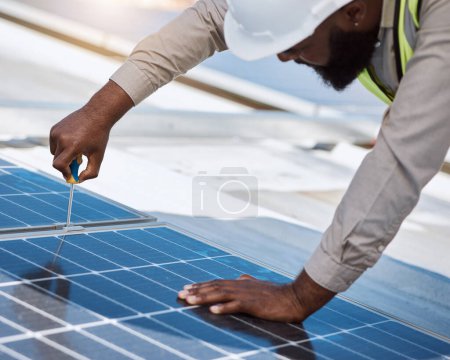 Photo for Black man, engineer and repair for solar panel, roof or maintenance for industry, thinking and building. Technician, screwdriver or tools for photovoltaic tech, helmet or sustainable renewable energy. - Royalty Free Image