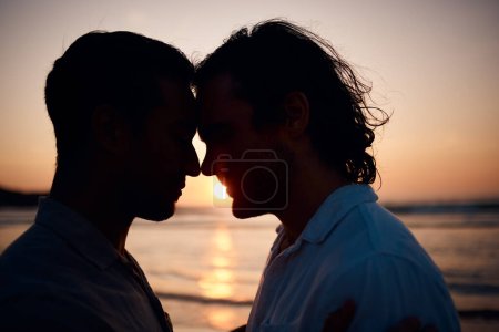Photo for Beach, sunset and gay couple in silhouette, embrace and love on summer island vacation together in Thailand. Sun, ocean and romance, lgbt men in nature and relax on holiday with pride, sea and light - Royalty Free Image