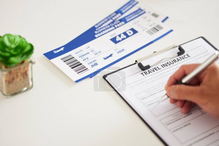 Photo for Paperwork, travel and insurance, plane ticket and sign contract with pen, person with holiday and compliance. Policy, safety and boarding pass, documents for journey and agreement with signature. - Royalty Free Image