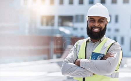 Photo for Man, engineering portrait and arms crossed at city construction site, solar panels and rooftop design technician. Happy face of african person, architecture, worker or contractor in outdoor mockup. - Royalty Free Image