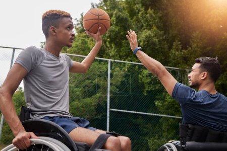 Photo for Sports, basketball goal and men in wheelchair for playing competition, challenge and practice outdoors. Fitness, wellness and male people with disability with ball for training, workout and exercise. - Royalty Free Image